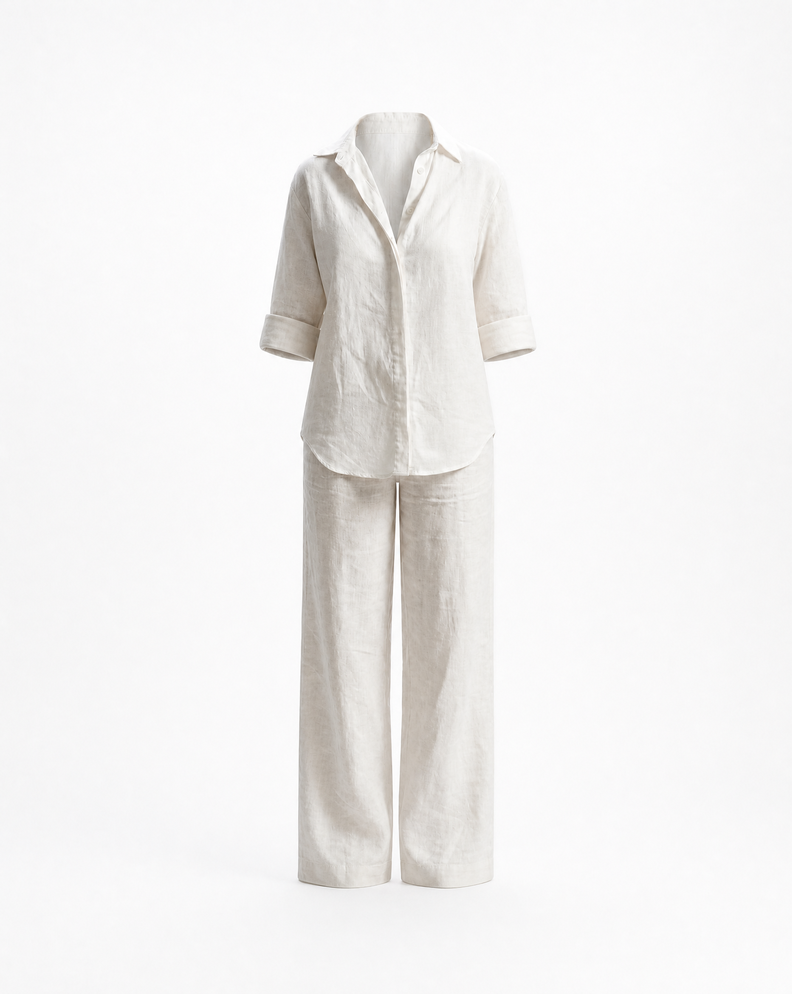 White linen shirt and pants set on a white background